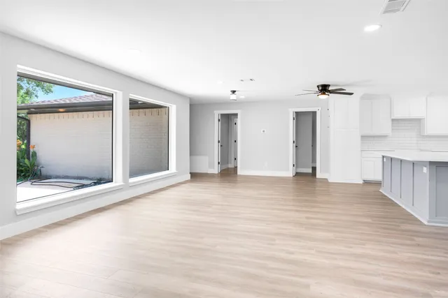 a view of an empty room with a window