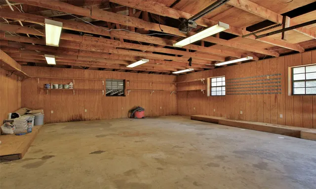 a view of a room with wooden walls