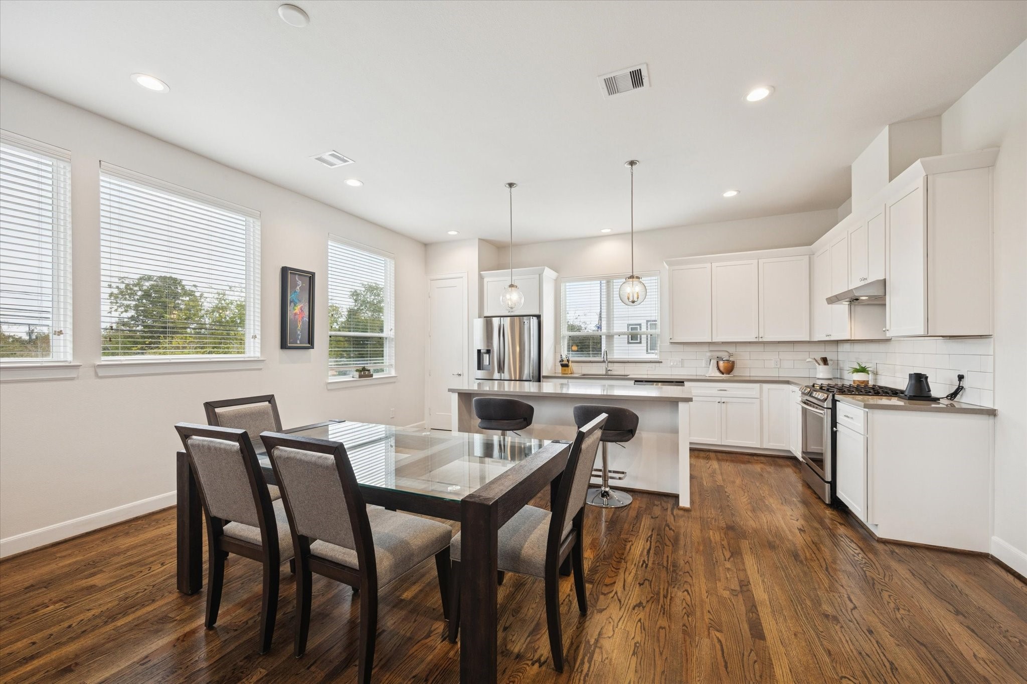 1055 Timbergrove Yards Lane Houston, TX 77008 - Photo 8 of 27 a view of a dining room with furniture and wooden floor