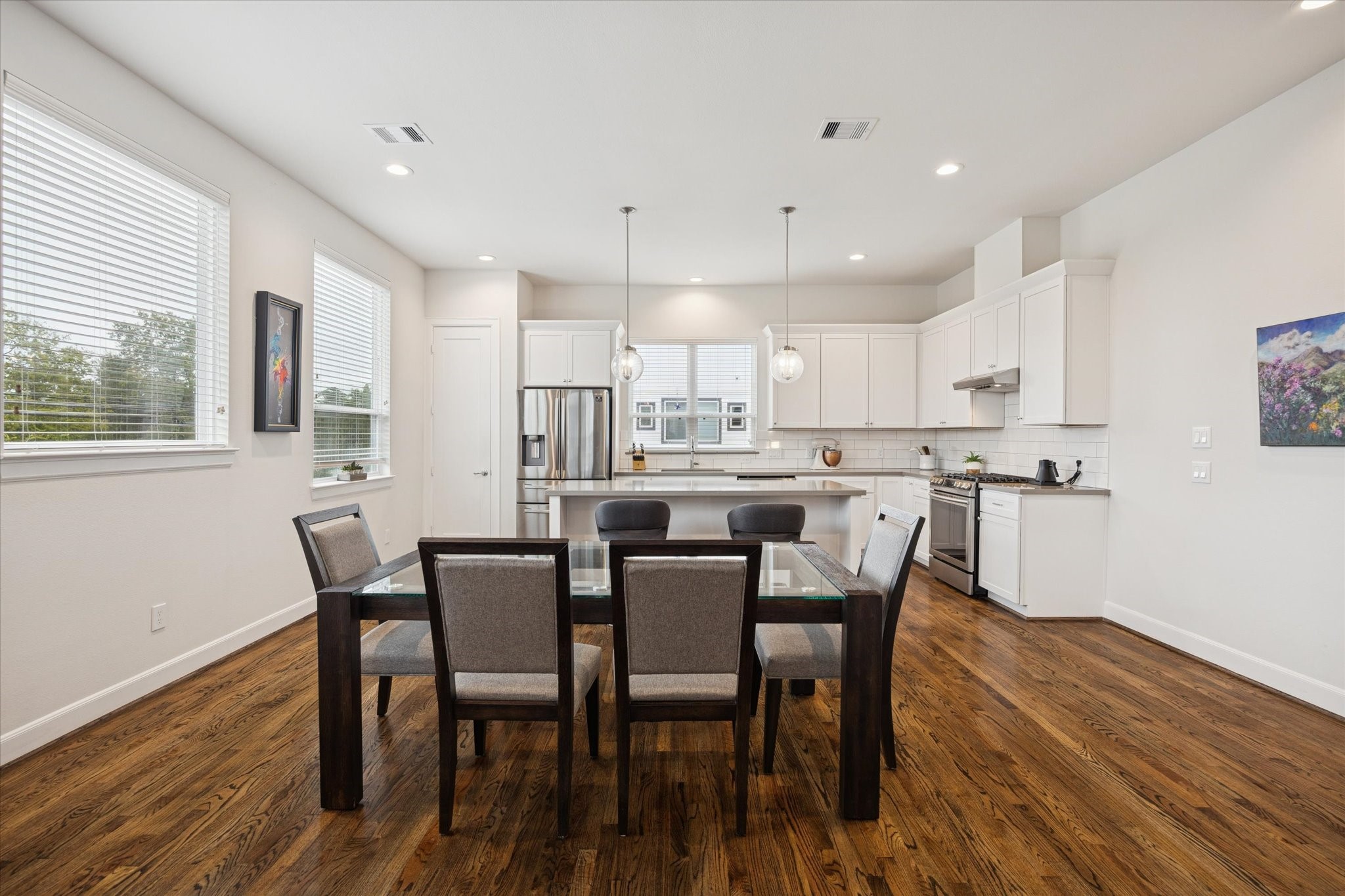 1055 Timbergrove Yards Lane Houston, TX 77008 - Photo 9 of 27 a view of a dining room with furniture and wooden floor