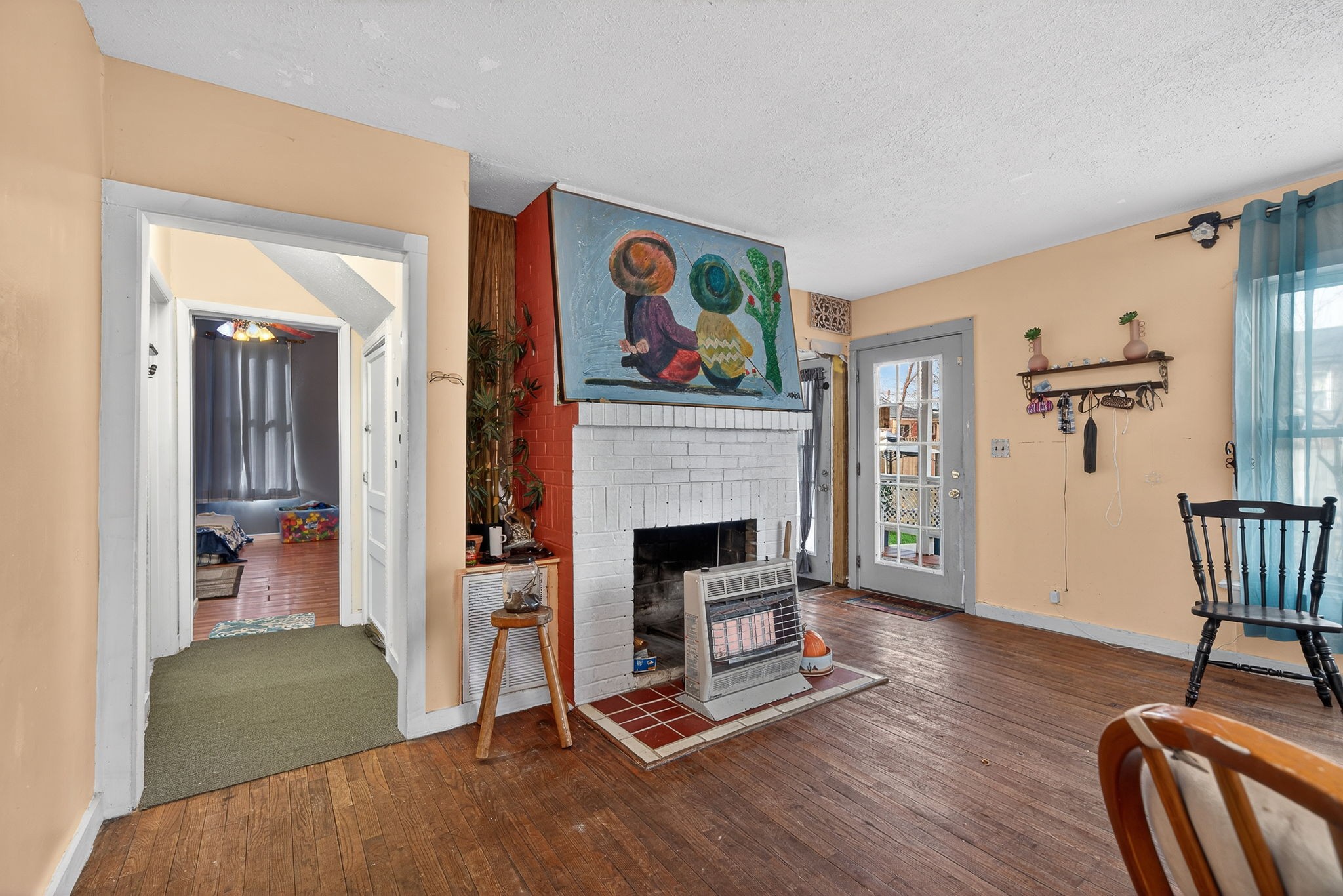 7 Marshall Street Sparta, TN 38583 - Photo 3 of 36 a living room with furniture and a fireplace