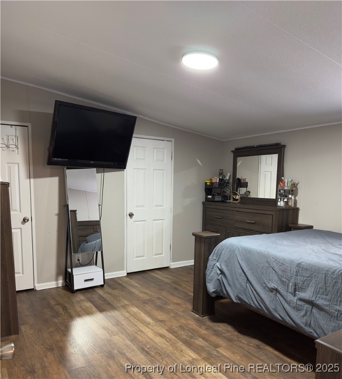 292 Grenada Road Fayetteville, NC 28306 - Photo 11 of 37 a bedroom with a bed and a television