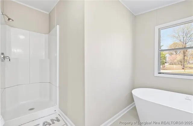 a bathroom with a granite countertop sink mirror and a bathtub