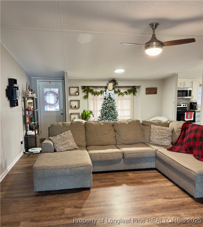 292 Grenada Road Fayetteville, NC 28306 - Photo 17 of 37 a living room with furniture and a flat screen tv