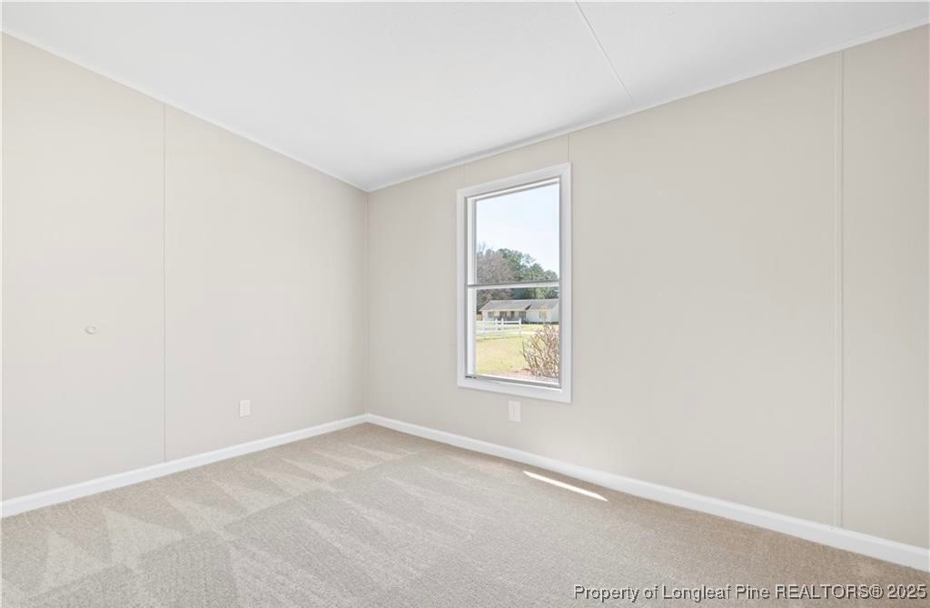 292 Grenada Road Fayetteville, NC 28306 - Photo 22 of 37 an empty room with a window
