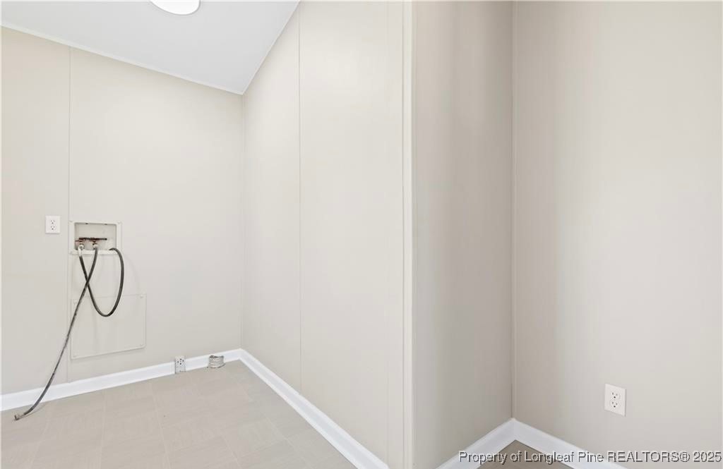 292 Grenada Road Fayetteville, NC 28306 - Photo 24 of 37 a bathroom with a glass shower door with a glass door