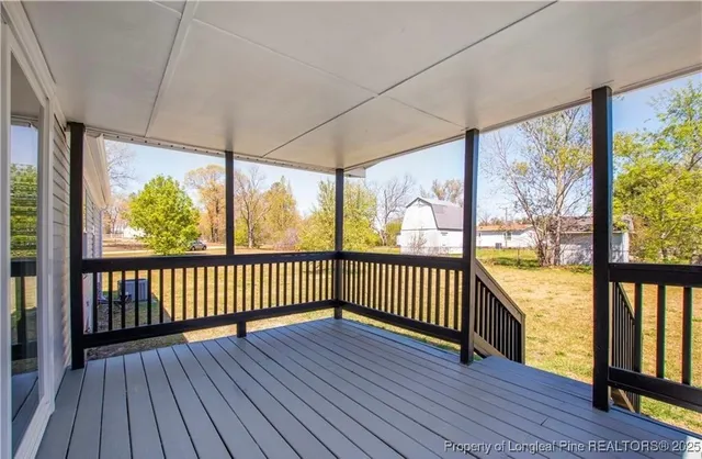 a front view of house with yard and trees