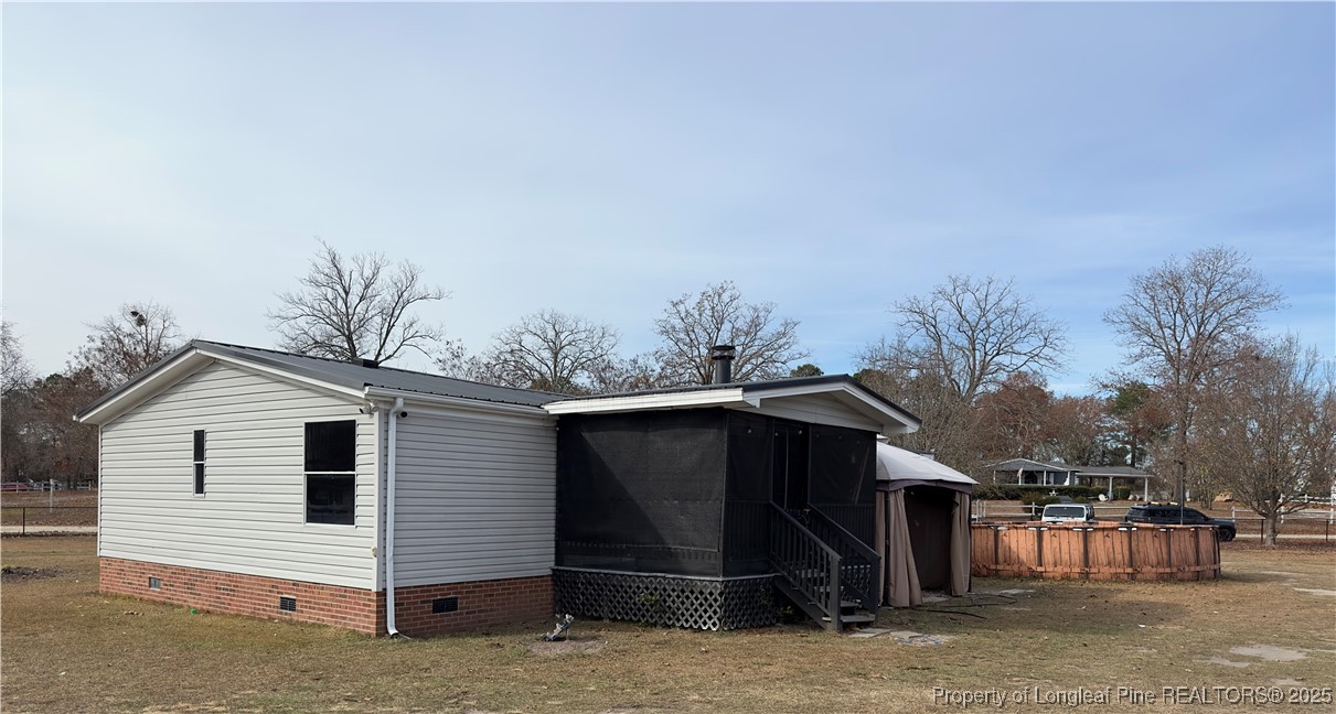 292 Grenada Road Fayetteville, NC 28306 - Photo 26 of 37 a view of a house with a backyard
