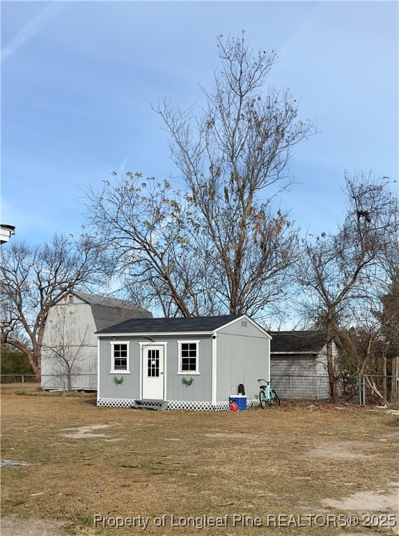 292 Grenada Road Fayetteville, NC 28306 - Photo 27 of 37 a front view of house with yard and trees