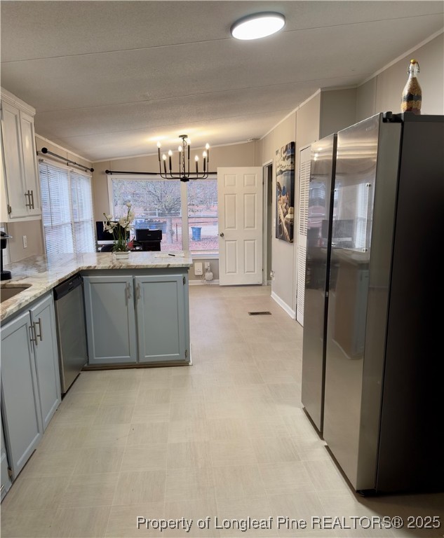 292 Grenada Road Fayetteville, NC 28306 - Photo 8 of 37 a kitchen with stainless steel appliances a refrigerator and a sink