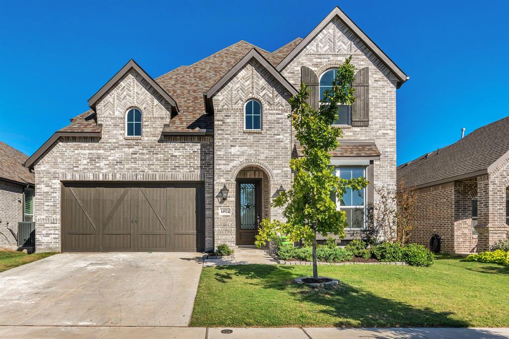 14924 Nightmist Road Aledo, TX 76008 - Photo 1 of 1 a front view of a house with a yard and garage