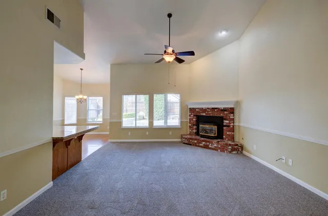 a view of a kitchen and dining room