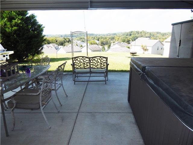 3960 Stephens Ridge Way Antioch, TN 37013 - Photo 15 of 20 36x20 rear patio slab with a 24x20 covered roof perfect for relaxing or entertaining and provides beautiful Tennessee hillside views.