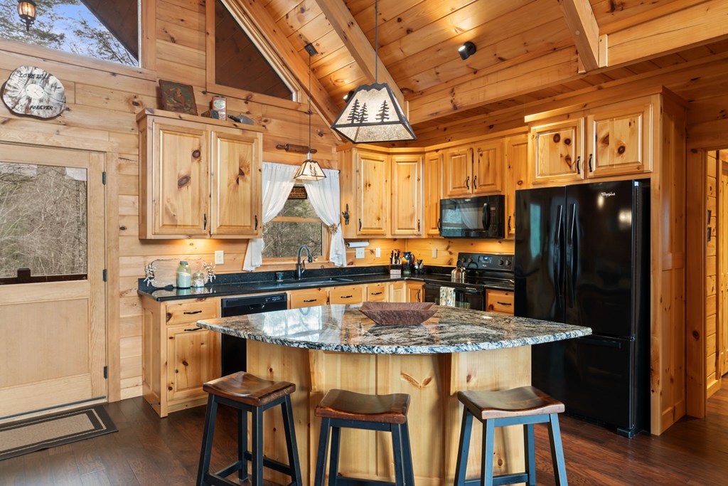 197 Cashes Valley Cherry Log, GA 30522 - Photo 18 of 67 a kitchen with a table and chairs in it
