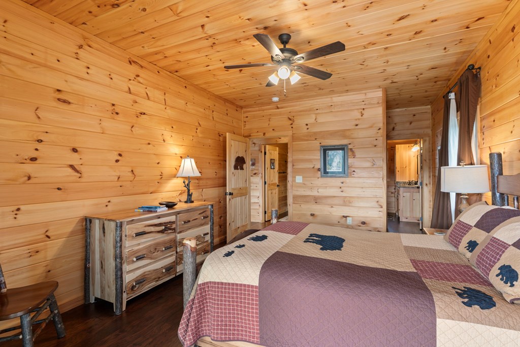 197 Cashes Valley Cherry Log, GA 30522 - Photo 23 of 67 a bedroom with a bed and wooden floor