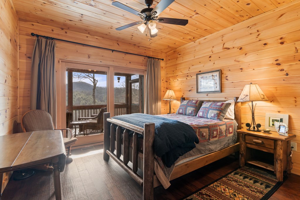 197 Cashes Valley Cherry Log, GA 30522 - Photo 25 of 67 a bedroom with a bed next to a window with the outer view