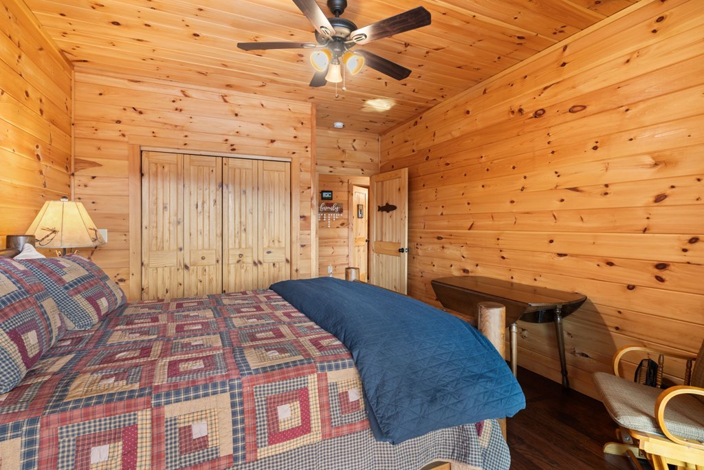 197 Cashes Valley Cherry Log, GA 30522 - Photo 26 of 67 a bedroom with a bed and a table