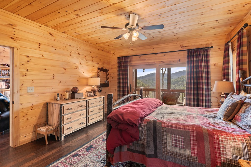 197 Cashes Valley Cherry Log, GA 30522 - Photo 29 of 67 a bed sitting in a bedroom next to a window