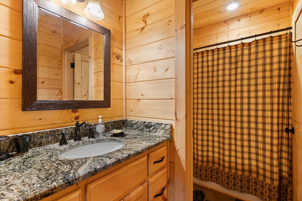197 Cashes Valley Cherry Log, GA 30522 - Photo 35 of 67 a bathroom with a granite countertop sink and a mirror