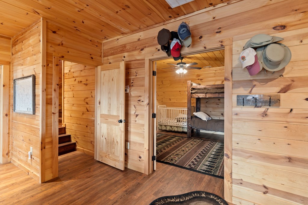 197 Cashes Valley Cherry Log, GA 30522 - Photo 43 of 67 a view of a hallway with wooden floor and a bathroom