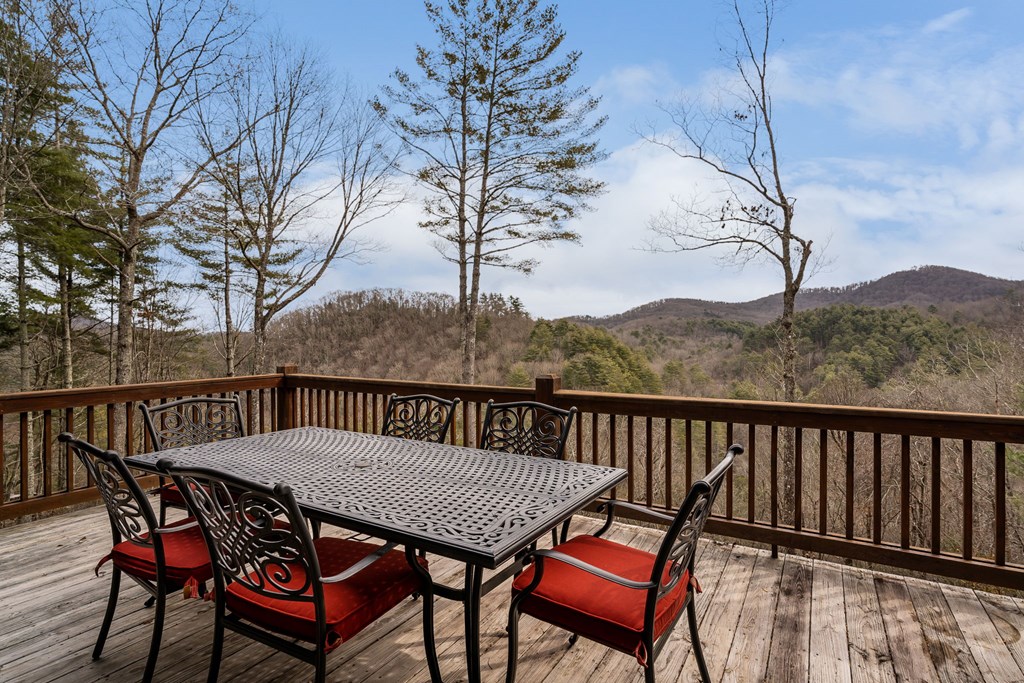 197 Cashes Valley Cherry Log, GA 30522 - Photo 51 of 67 a view of a balcony with furniture and wooden floor