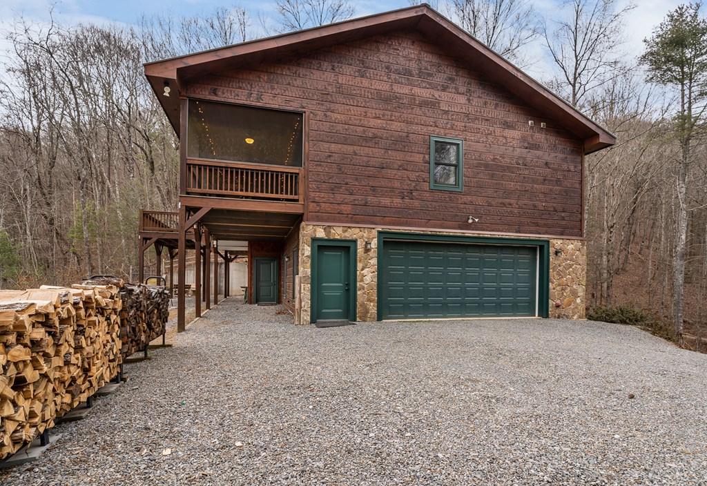 197 Cashes Valley Cherry Log, GA 30522 - Photo 63 of 67 a front view of a house with a yard and garage