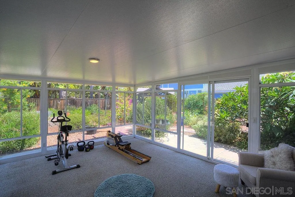 1450 Ridgeway Street Oceanside, CA 92054 - Photo 14 of 41 a view of a room with gym equipment and floor to ceiling window