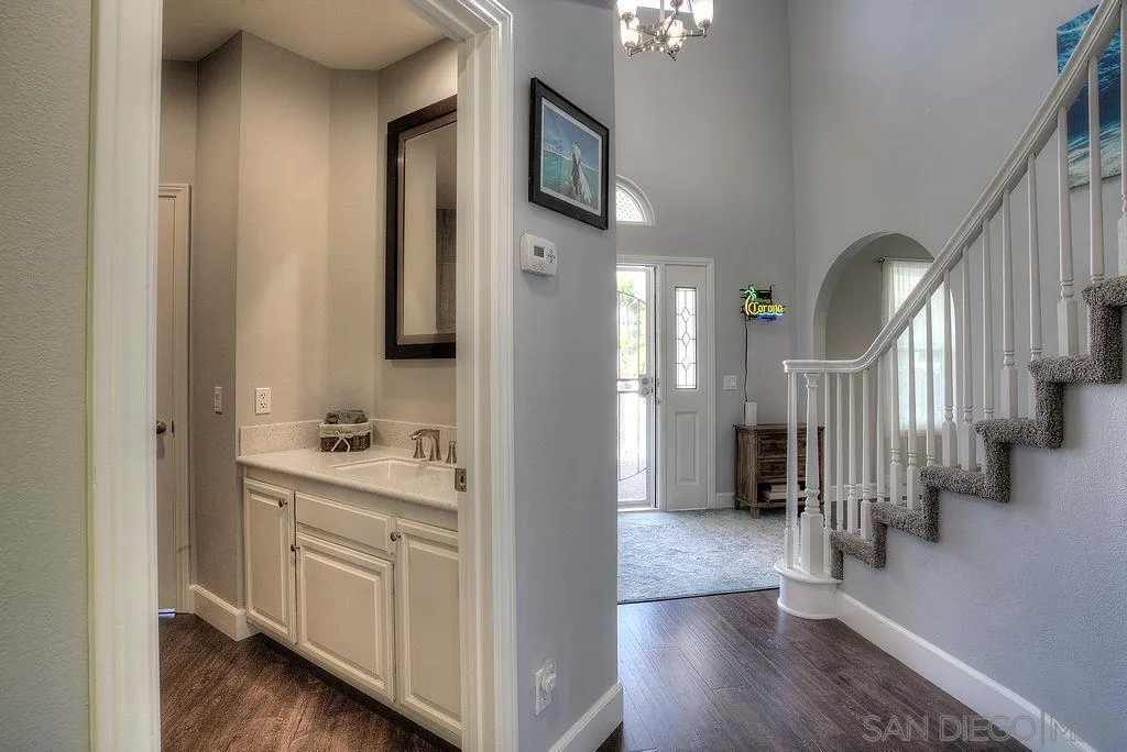 1450 Ridgeway Street Oceanside, CA 92054 - Photo 16 of 41 a view of entryway and hall with wooden floor