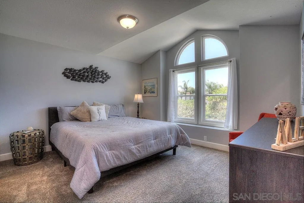 1450 Ridgeway Street Oceanside, CA 92054 - Photo 21 of 41 a bedroom with a bed and a window