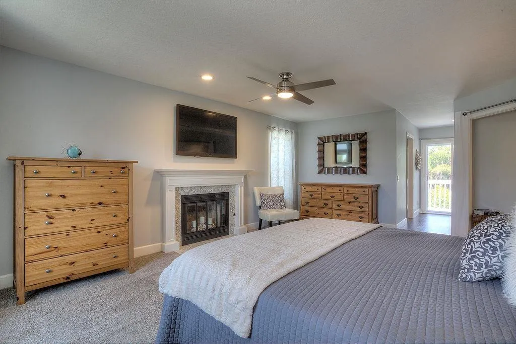 1450 Ridgeway Street Oceanside, CA 92054 - Photo 26 of 41 a spacious bedroom with a large bed and a tv