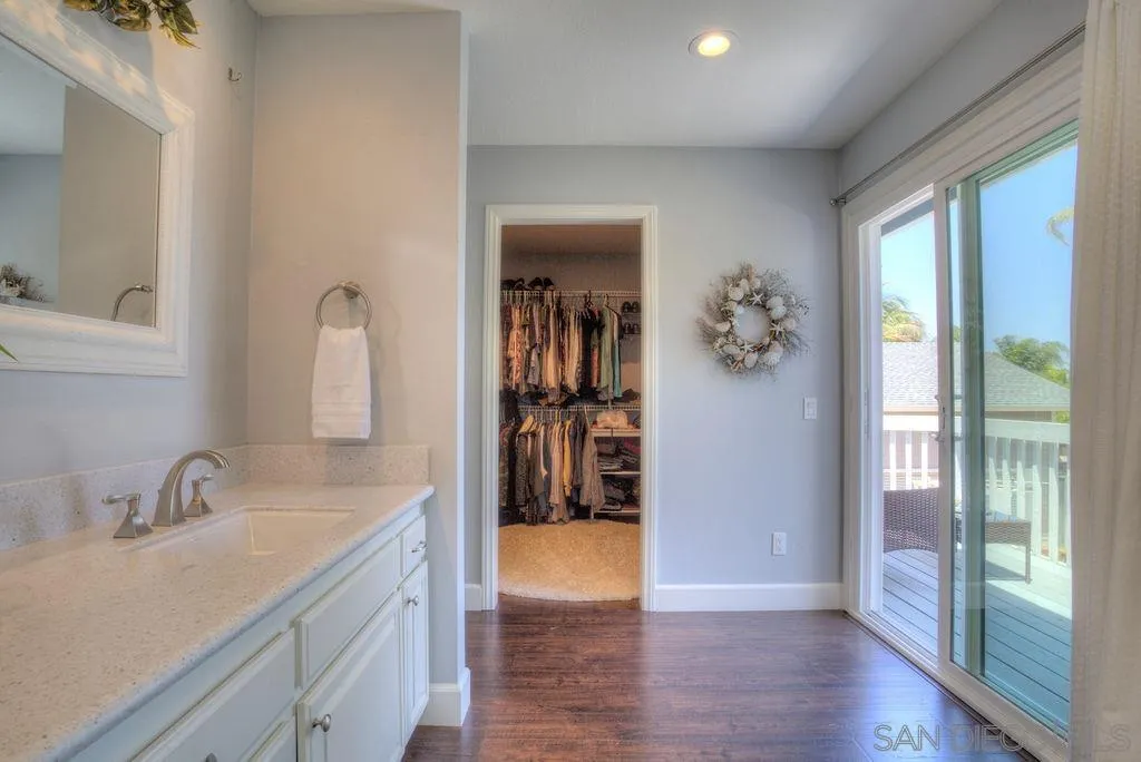 1450 Ridgeway Street Oceanside, CA 92054 - Photo 27 of 41 a en suite bathroom with a sink and a mirror