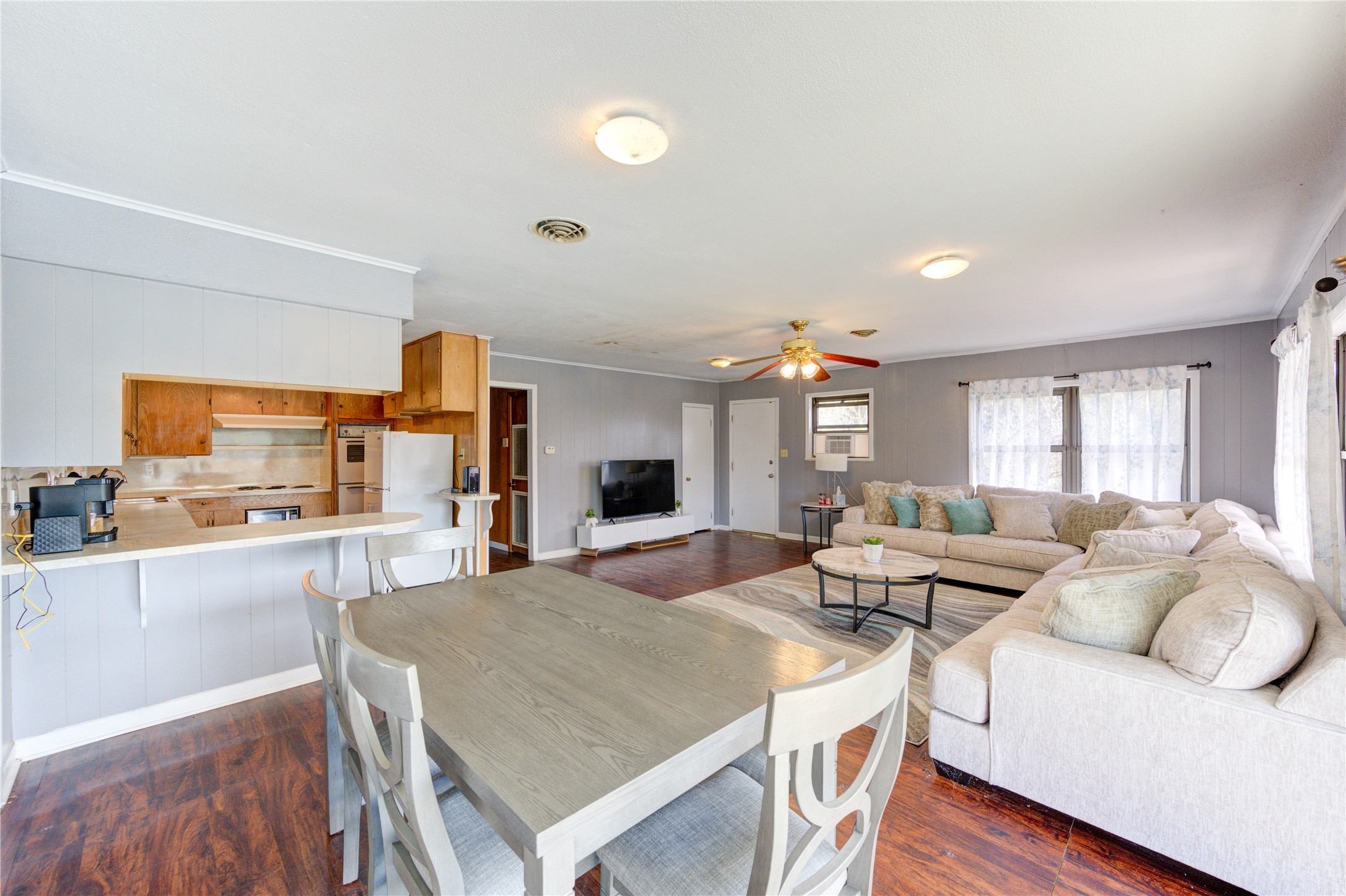 232 Hideaway Lane Goodrich, TX 77335 - Photo 11 of 34 a living room with stainless steel appliances furniture a couch and a kitchen view