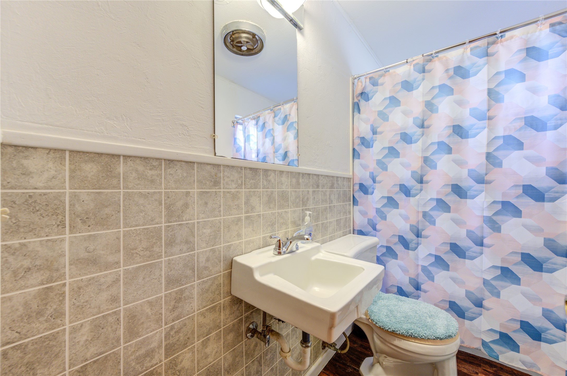 232 Hideaway Lane Goodrich, TX 77335 - Photo 25 of 34 a bathroom with a sink a toilet and a mirror