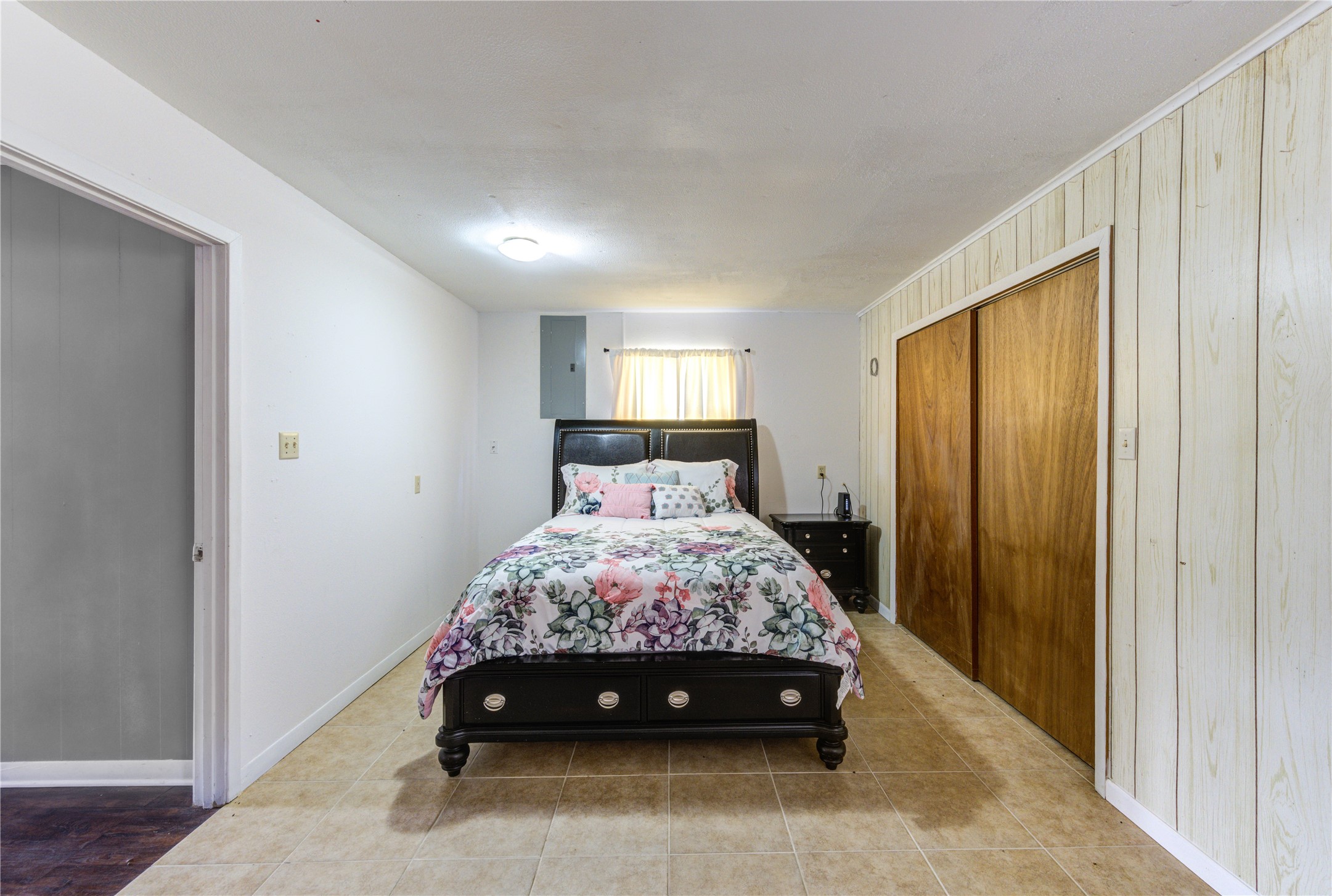 232 Hideaway Lane Goodrich, TX 77335 - Photo 26 of 34 a bed sitting in a bedroom next to a window and a wooden floor