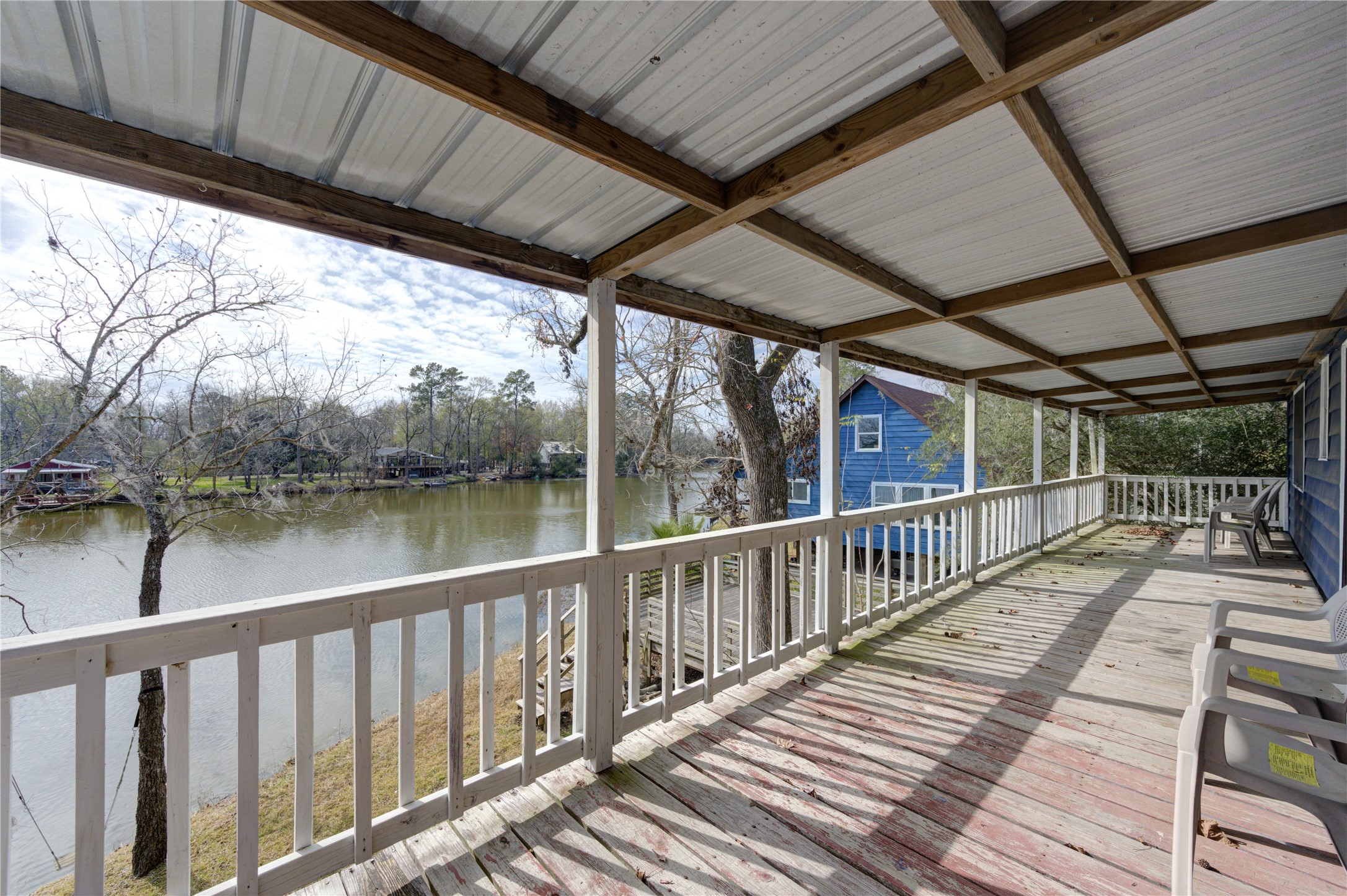 232 Hideaway Lane Goodrich, TX 77335 - Photo 29 of 34 Back covered patio looking out onto the lake