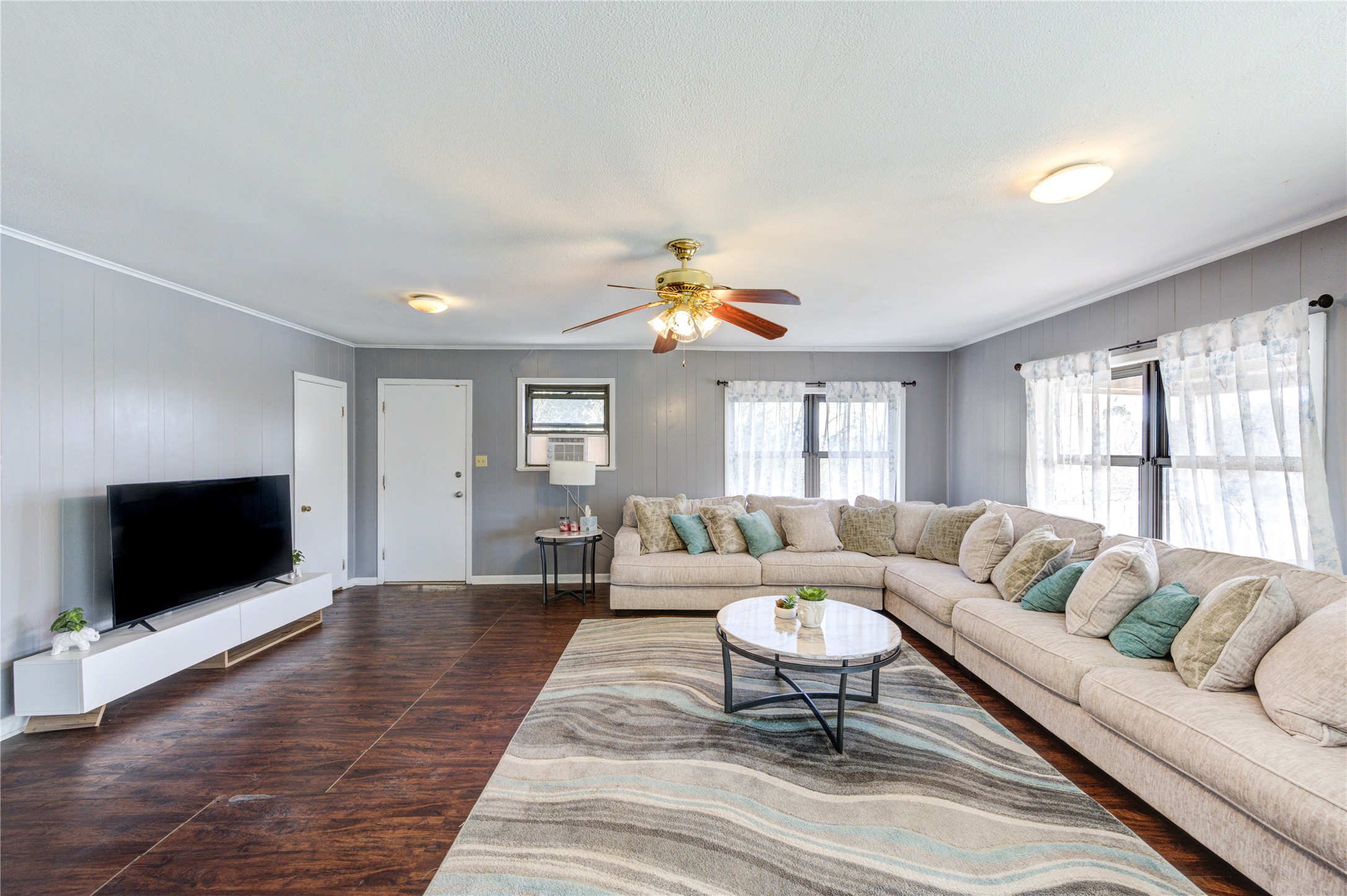 232 Hideaway Lane Goodrich, TX 77335 - Photo 10 of 34 a living room with furniture a flat screen tv and a window