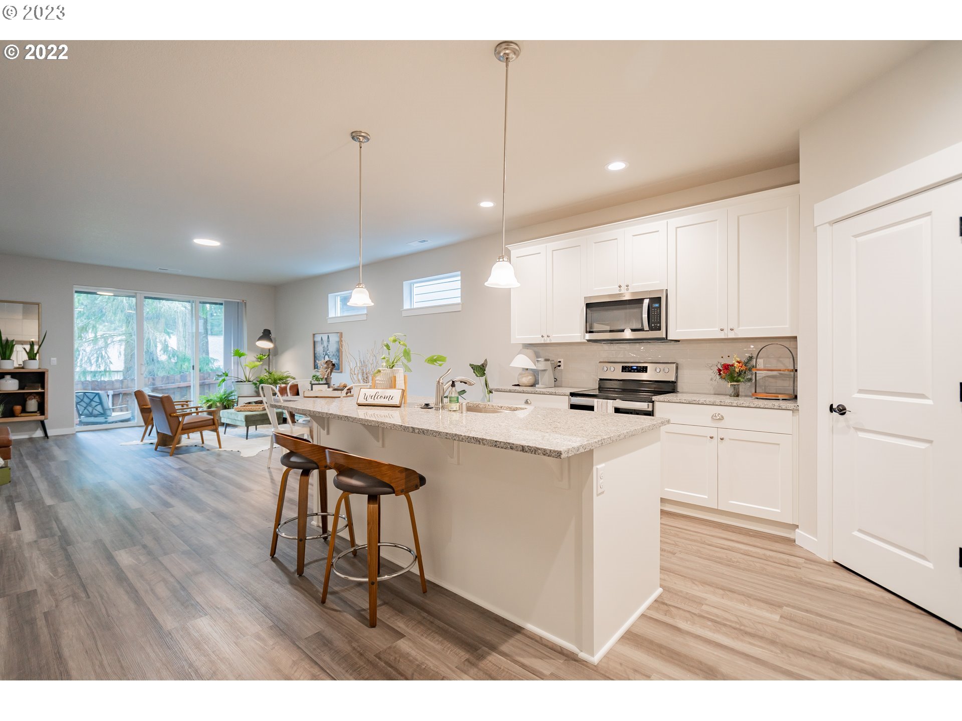7209 South 13th Street Ridgefield, WA 98642 - Photo 2 of 7 a kitchen with counter space appliances and a dining table