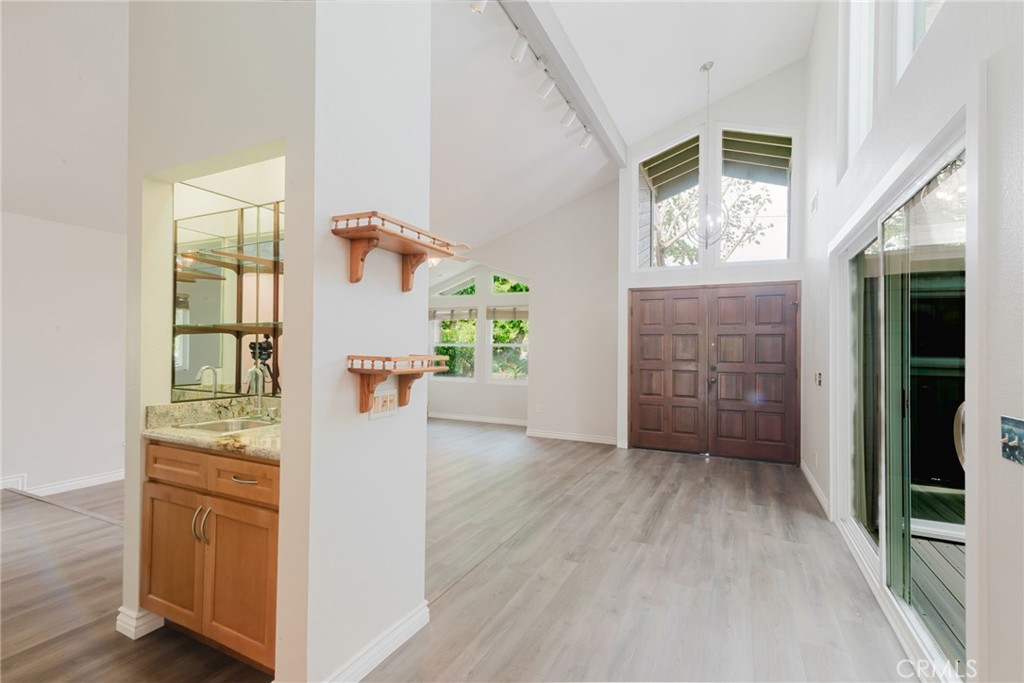 1901 Laurel Road Oceanside, CA 92054 - Photo 12 of 54 Wet bar and looking back to the doubledoor entry to the home