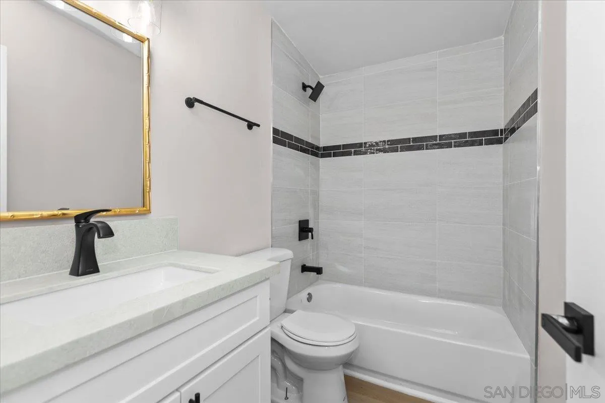 9255 Fairlawn Street Santee, CA 92071 - Photo 11 of 34 a bathroom with a sink a toilet and a bathtub