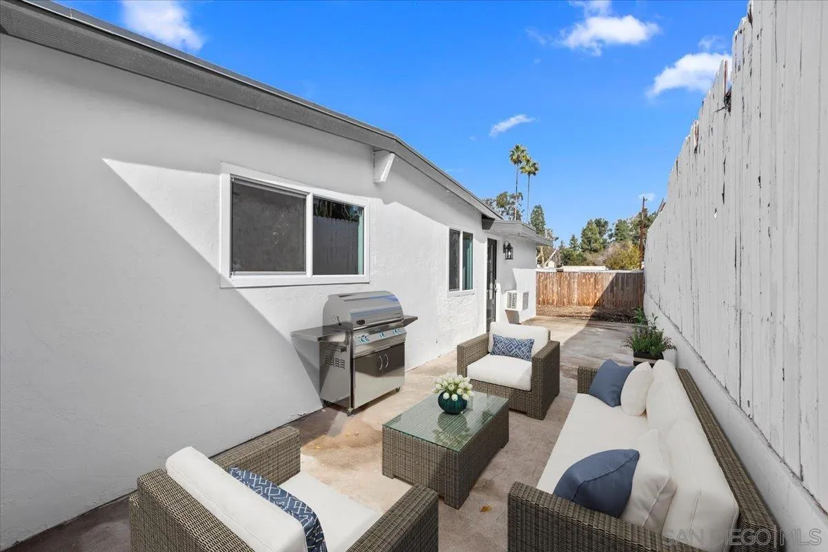 9255 Fairlawn Street Santee, CA 92071 - Photo 19 of 34 a view of backyard of a house with wooden floor and furniture
