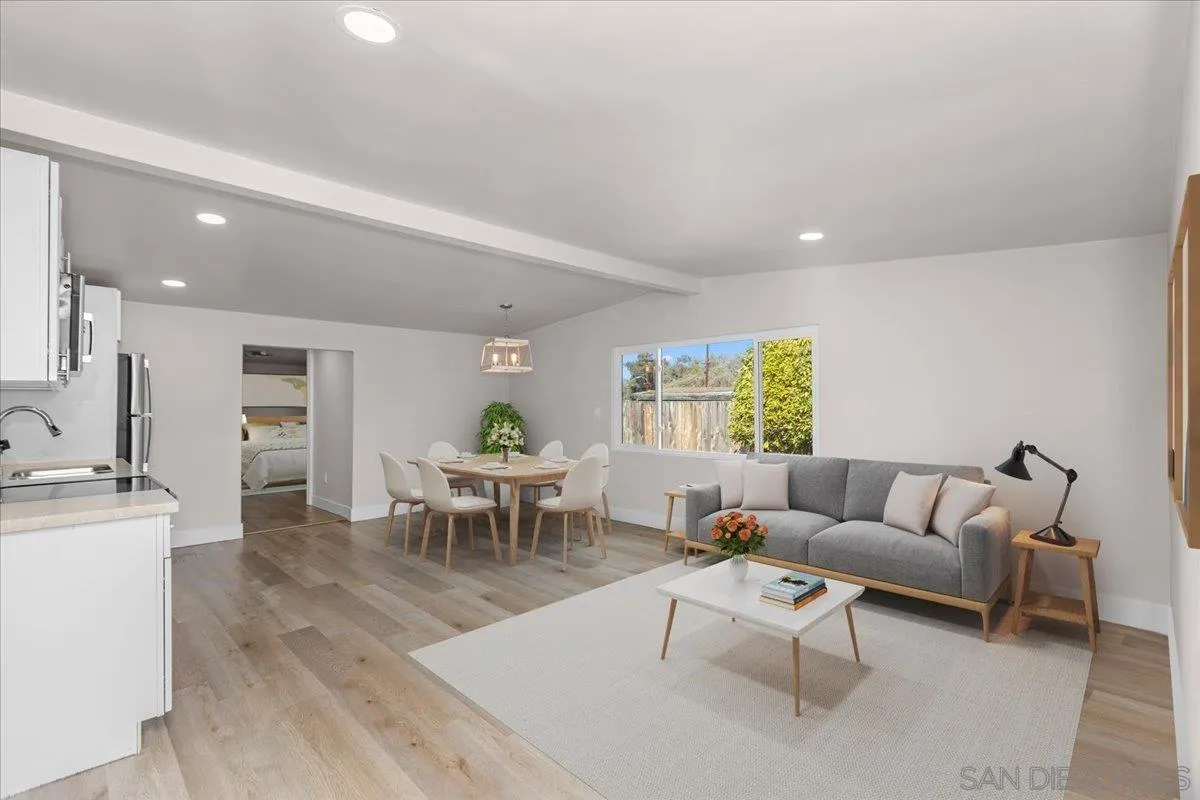 9255 Fairlawn Street Santee, CA 92071 - Photo 22 of 34 a living room with furniture and a dining table with kitchen view