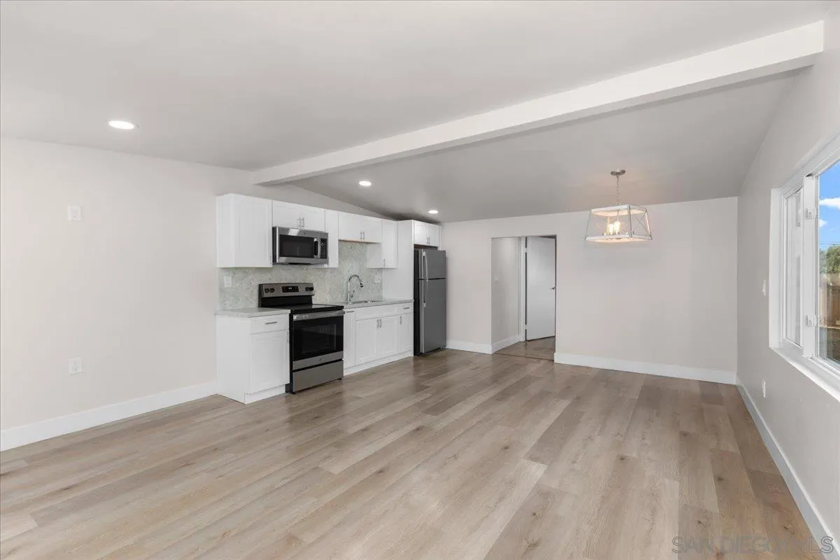 9255 Fairlawn Street Santee, CA 92071 - Photo 27 of 34 a view of kitchen with wooden floor and electronic appliances