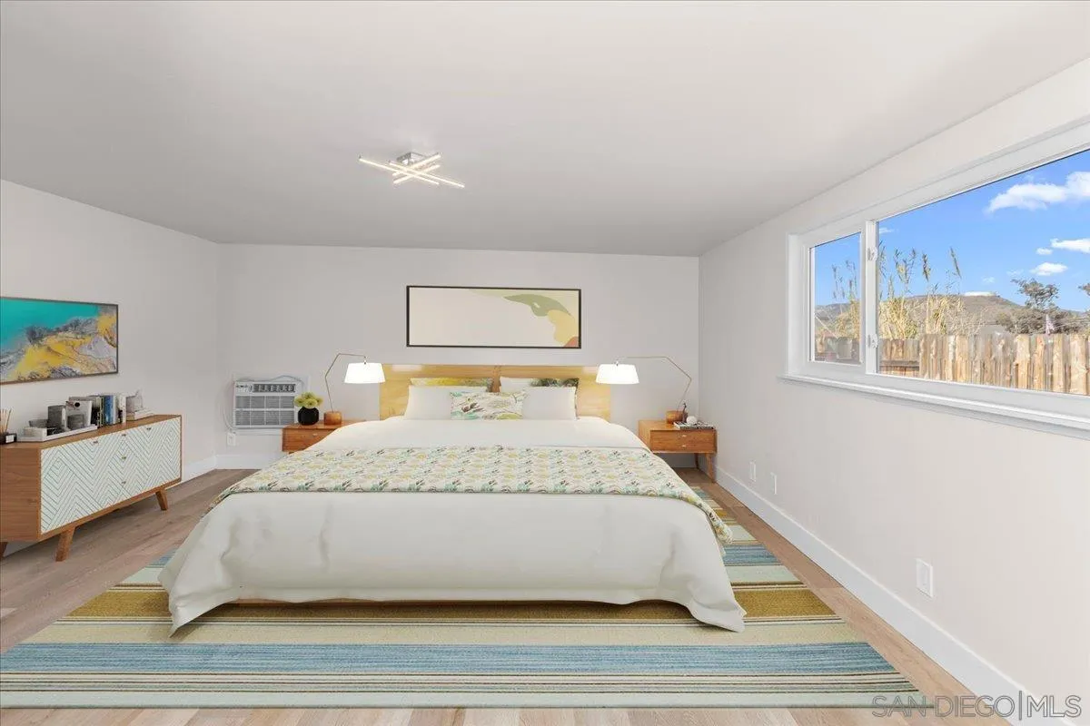 9255 Fairlawn Street Santee, CA 92071 - Photo 29 of 34 a bedroom with a bed and a night stand
