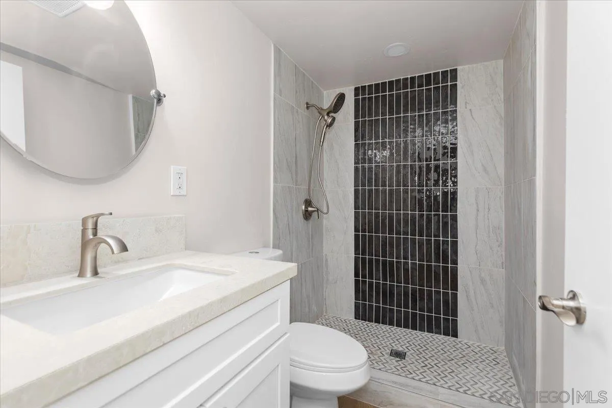 9255 Fairlawn Street Santee, CA 92071 - Photo 31 of 34 a bathroom with a sink a toilet and shower