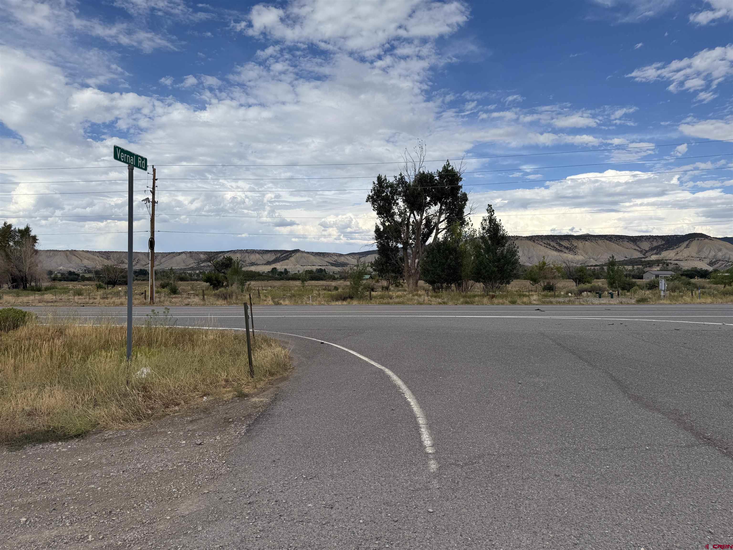 68671 Vernal Road Montrose, CO 81403 - Photo 9 of 13 a view of a water fountain and a car parked in the road