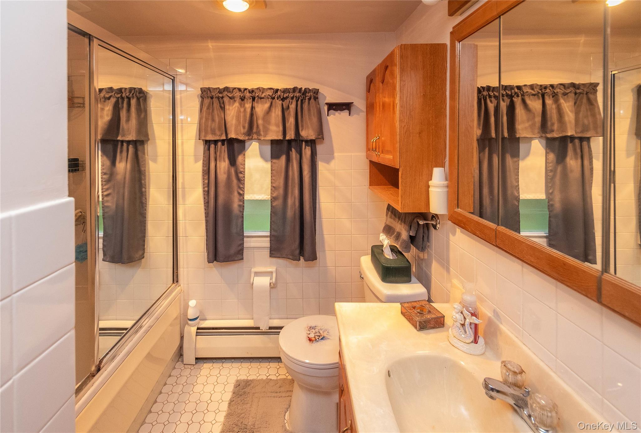 62 Thornton Road Wurtsboro, NY 12790 - Photo 12 of 30 a bathroom with a sink a toilet and shower