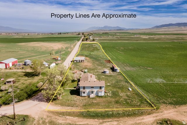 19994 South Olson Road Downey, ID 83234 - Photo 36 of 49 Aerial view of sparsely populated area with property boundaries highlighted and a mountainous background