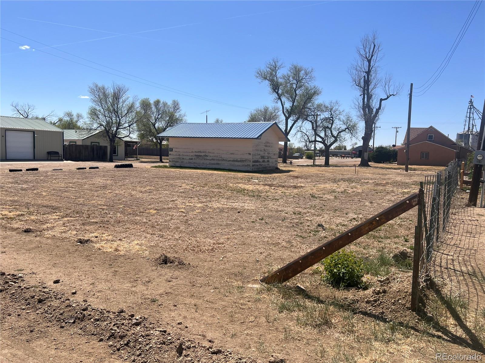 437 5th Street Hugo, CO 80821 - Photo 2 of 6 a view of a backyard of the house