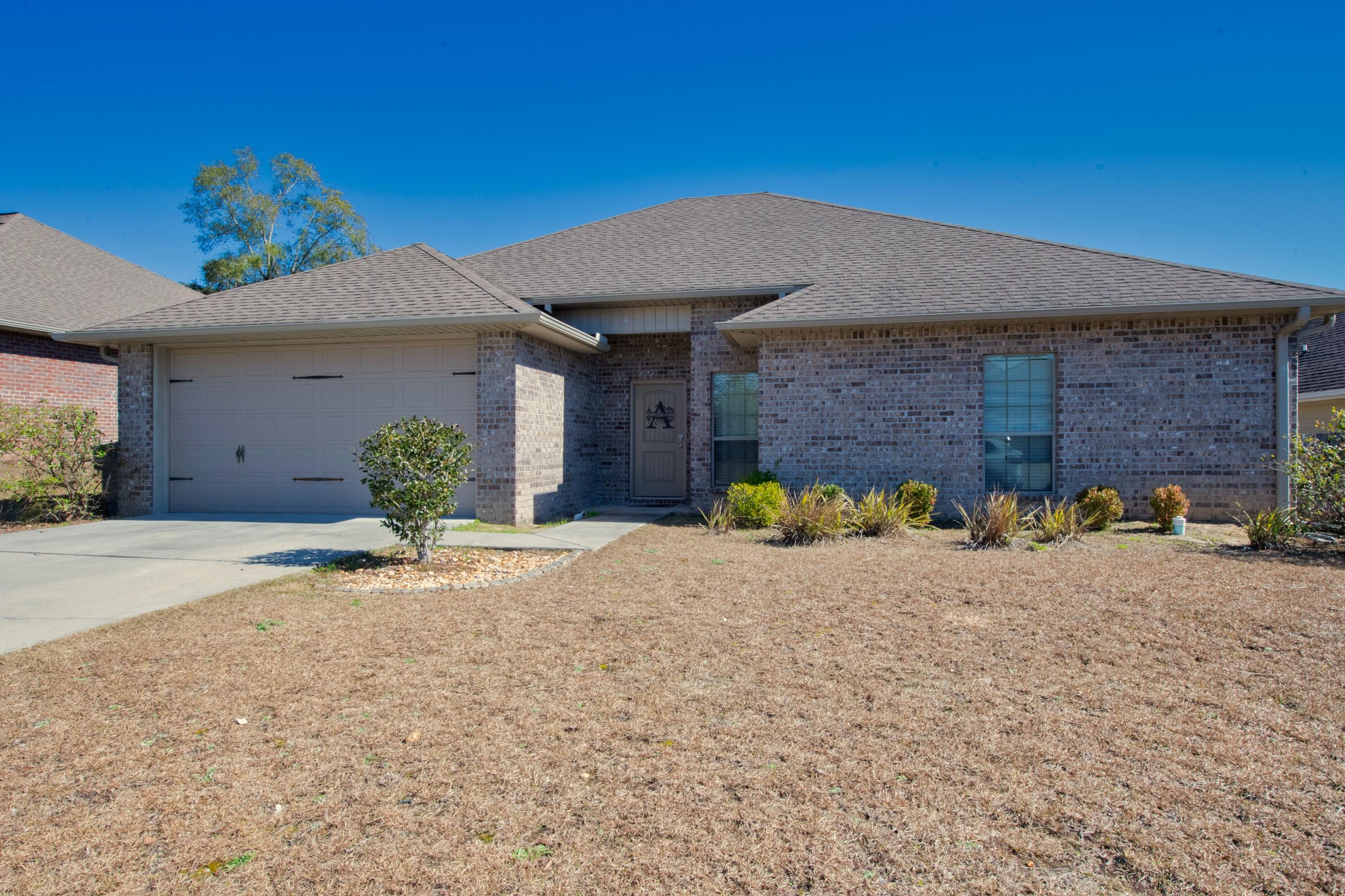 4608 Hermosa Road Crestview, FL 32539 - Photo 1 of 26 a view of a outdoor space with a small yard