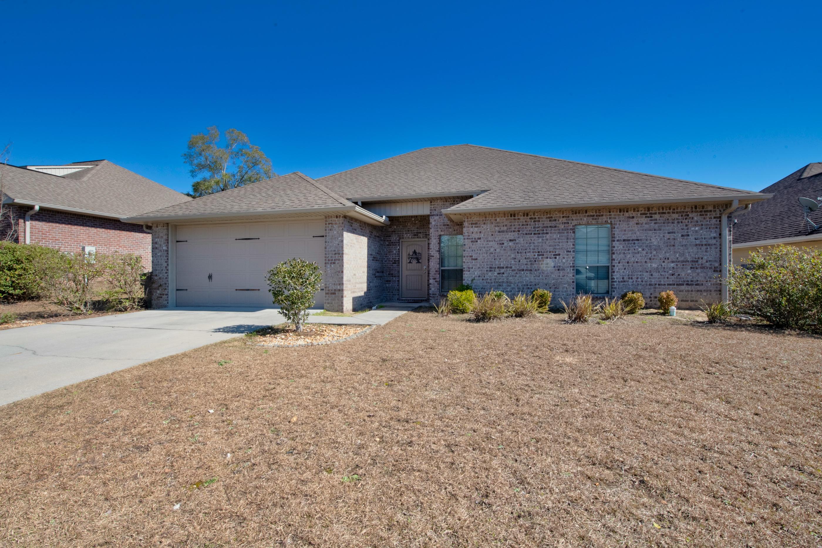 4608 Hermosa Road Crestview, FL 32539 - Photo 2 of 26 a view of a house with a patio